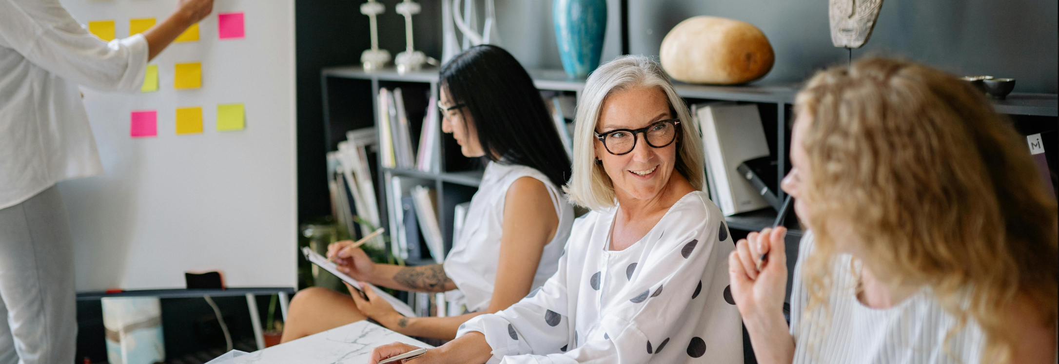 colleagues are engaging with one another in an office